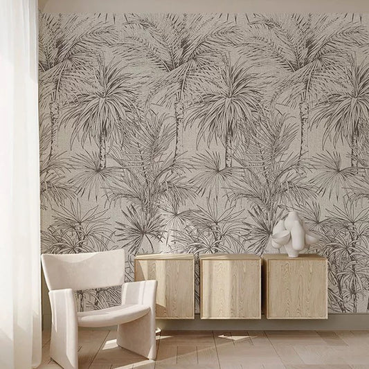 Room interior with palm leaf patterned wallpaper, wooden cabinet, and white chair.
