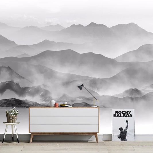 Room interior with a white dresser, lamp, poster against a mountain mural.