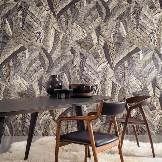 Dining room with a leaf patterned wall, table, and chairs.