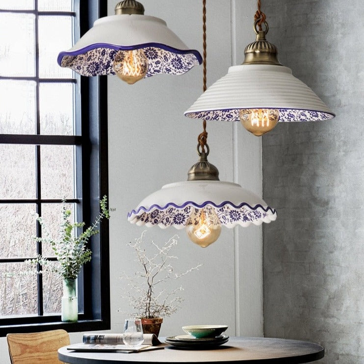 Modern minimalist ceramic pendant light with blue porcelain shade and vintage copper finish for restaurants and cafés