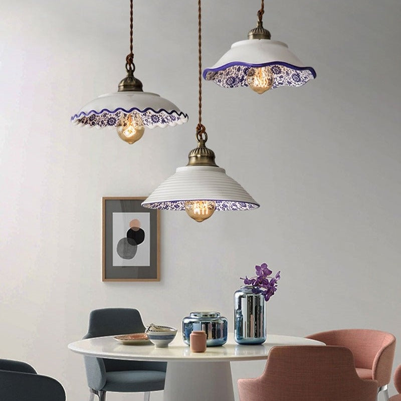 Modern minimalist ceramic pendant light with blue porcelain shade and vintage copper finish for restaurants and cafés