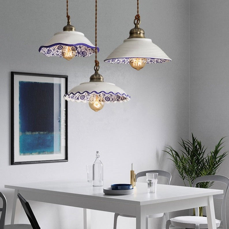 Modern minimalist ceramic pendant light with blue porcelain shade and vintage copper finish for restaurants and cafés
