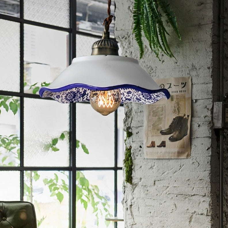 Modern minimalist ceramic pendant light with blue porcelain shade and vintage copper finish for restaurants and cafés