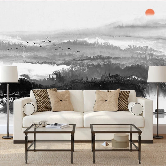 Living room with a white sofa, decorative pillows, and a large wall mural of a landscape.