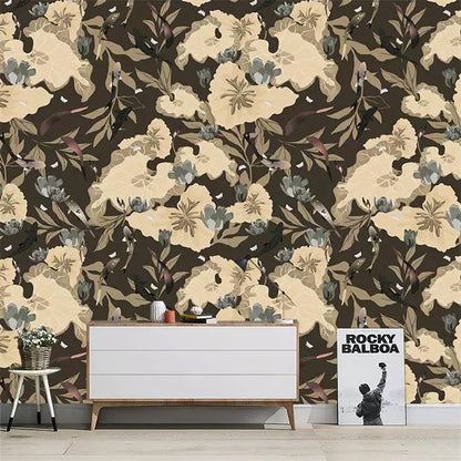 Floral wallpaper with beige flowers on a brown background, featuring a white dresser and decorative items.