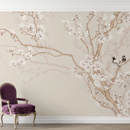 Wallpaper with floral design and a purple chair in front