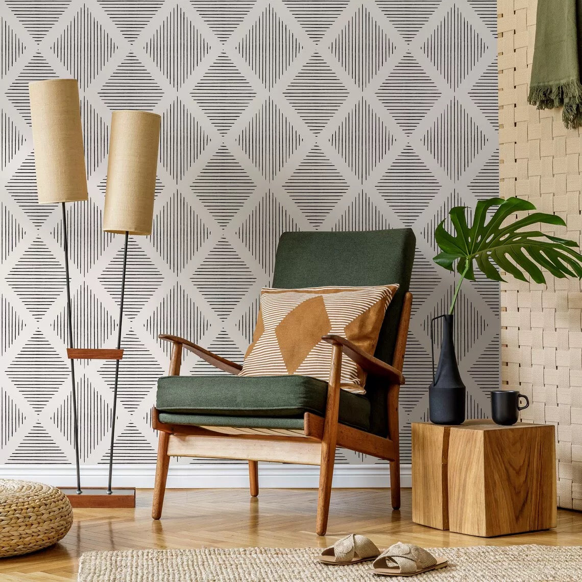 Modern living room with a green armchair, patterned wallpaper, and decorative items.
