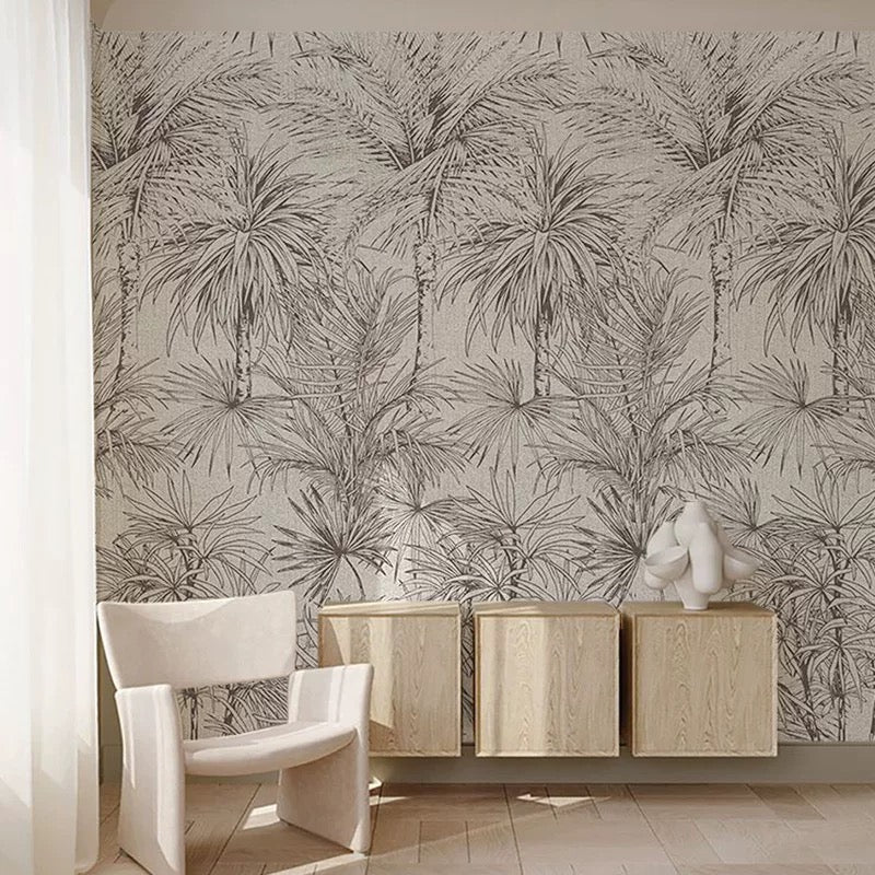 Room interior with palm leaf patterned wallpaper, wooden cabinet, and white chair.