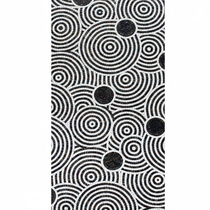 Black and white circular pattern on a textured surface