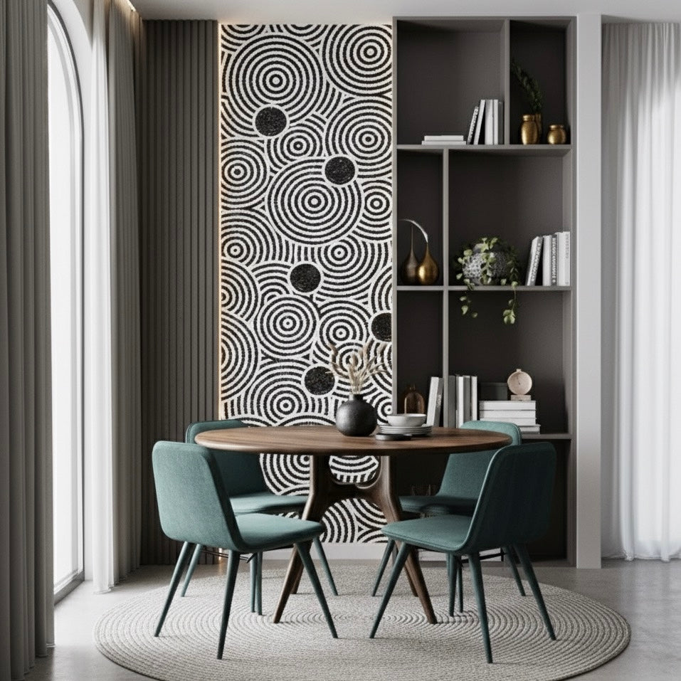 Modern dining room with a round table and green chairs, featuring a decorative mosaic wall mural.